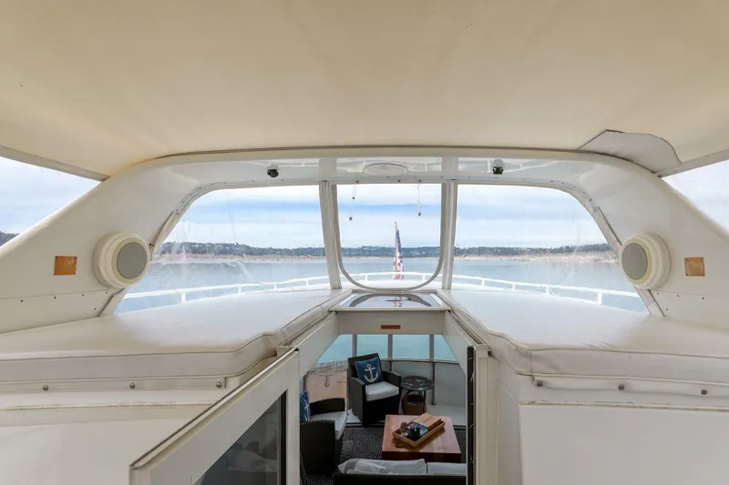 Slide: The Image of 1998 Hatteras 52 Sport Deck Motor Yacht interior with scenic water view. - 22