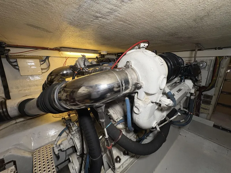 Slide: The Image of Engine room of a 1998 Hatteras 52 Sport Deck Motor Yacht, showcasing mechanical components. - 37