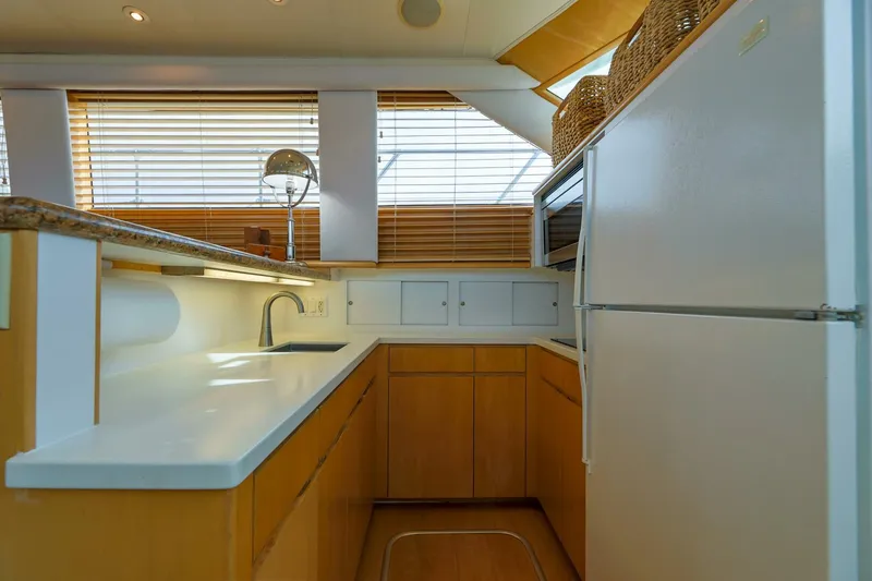 Slide: The Image of Interior kitchen of 1998 Hatteras 52 Sport Deck Motor Yacht with modern amenities. - 4