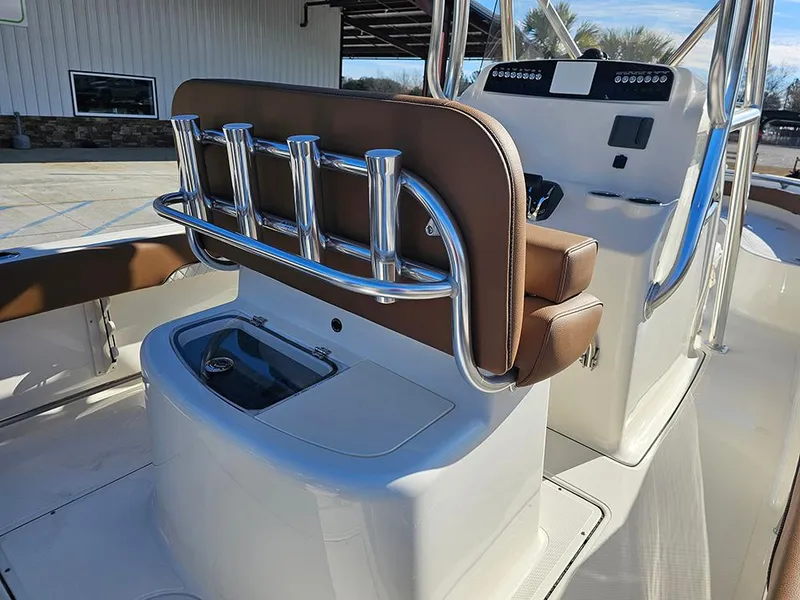 Slide: The Image of 2025 Pioneer 222 Sportfish boat interior with rod holders and seating. - 11