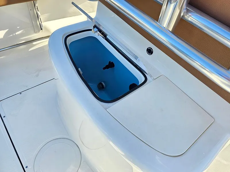 Slide: The Image of 2025 Pioneer 222 Sportfish boat with open storage compartment. - 12