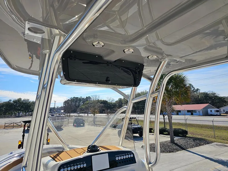 Slide: The Image of 2025 Pioneer 222 Sportfish boat interior with T-top and console view. - 17