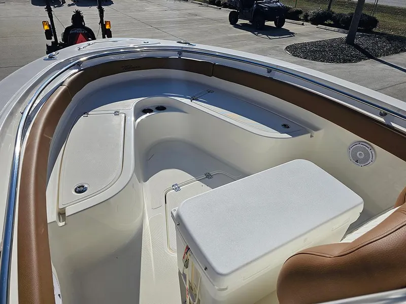 Slide: The Image of 2025 Pioneer 222 Sportfish boat interior with seating and storage compartments. - 22