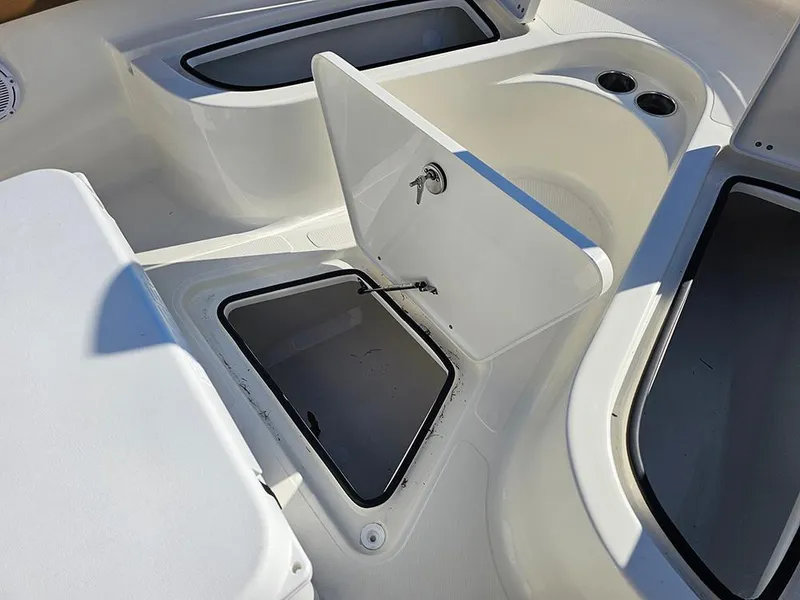 Slide: The Image of 2025 Pioneer 222 Sportfish boat interior with open storage compartments. - 24