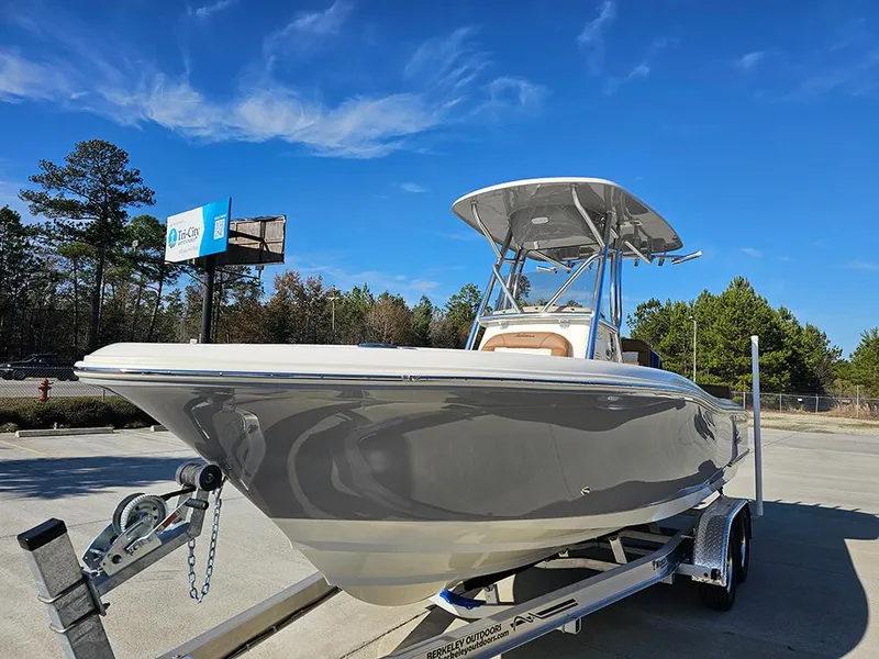 Slide: The Image of 2025 Pioneer 222 Sportfish boat on trailer under clear blue sky. - 5