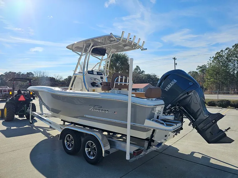 Slide: The Image of 2025 Pioneer 222 Sportfish boat on trailer with Yamaha engine, parked outdoors. - 7