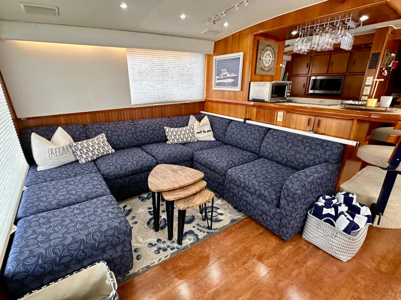 Slide: The Image of Luxurious interior of 1982 Bertram 54 Convertible yacht with plush seating and elegant decor. - 11
