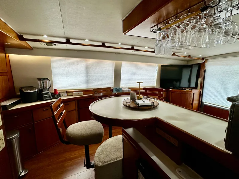 Slide: The Image of Interior of 1982 Bertram 54 Convertible yacht with modern kitchen and dining area. - 21