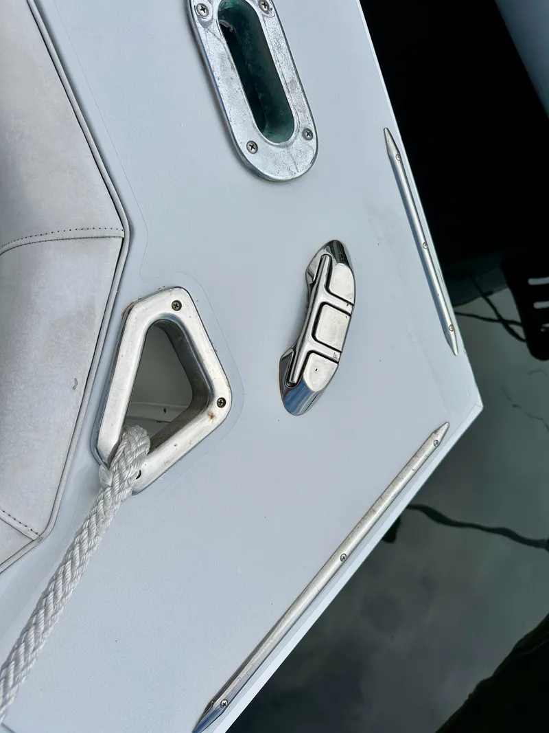 Slide: The Image of 1982 Bertram 54 Convertible boat deck with cleat and rope detail. - 47