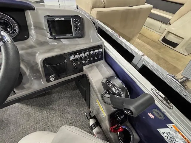 Slide: The Image of Control panel of 2025 Barletta ARIA 20QC boat with navigation system and seating area. - 11