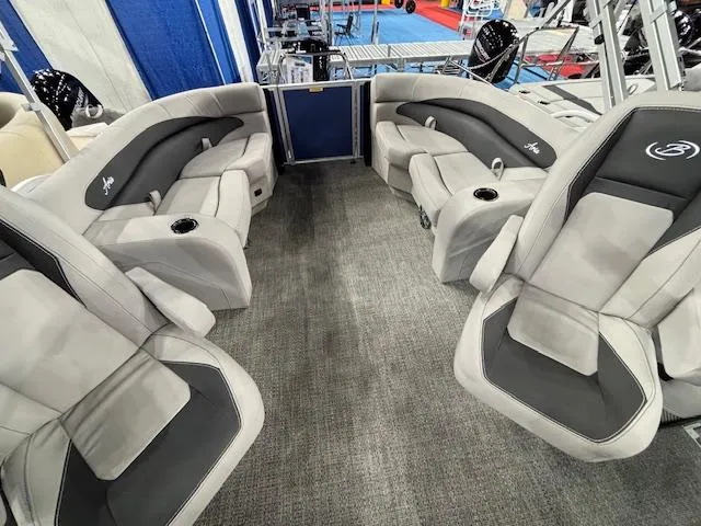 Slide: The Image of 2025 Barletta ARIA 20QC pontoon boat interior with plush seating and cup holders. - 20