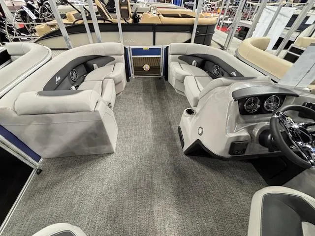 Slide: The Image of 2025 Barletta ARIA 20QC pontoon boat interior with plush seating and modern dashboard. - 7