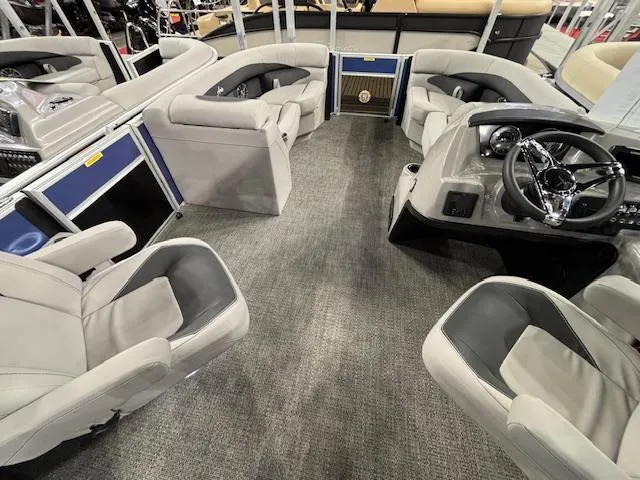 Slide: The Image of 2025 Barletta ARIA 20QC pontoon boat interior with plush seating and modern dashboard. - 8