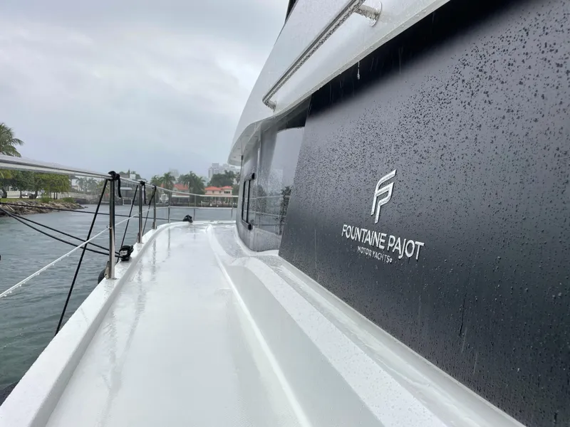 Slide: The Image of 2020 Fountaine Pajot MY 44 yacht in rainy weather, dockside view. - 14