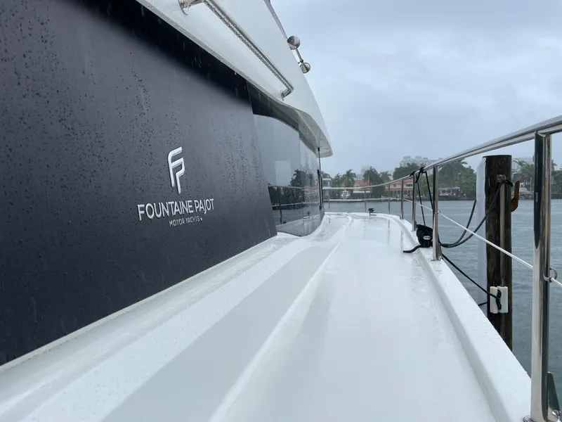 Slide: The Image of Fountaine Pajot MY 44 yacht, 2020 model, on a rainy day by the water. - 15