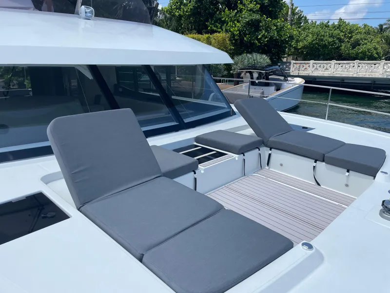 Slide: The Image of 2020 Fountaine Pajot MY 44 yacht with sun loungers on deck. - 18