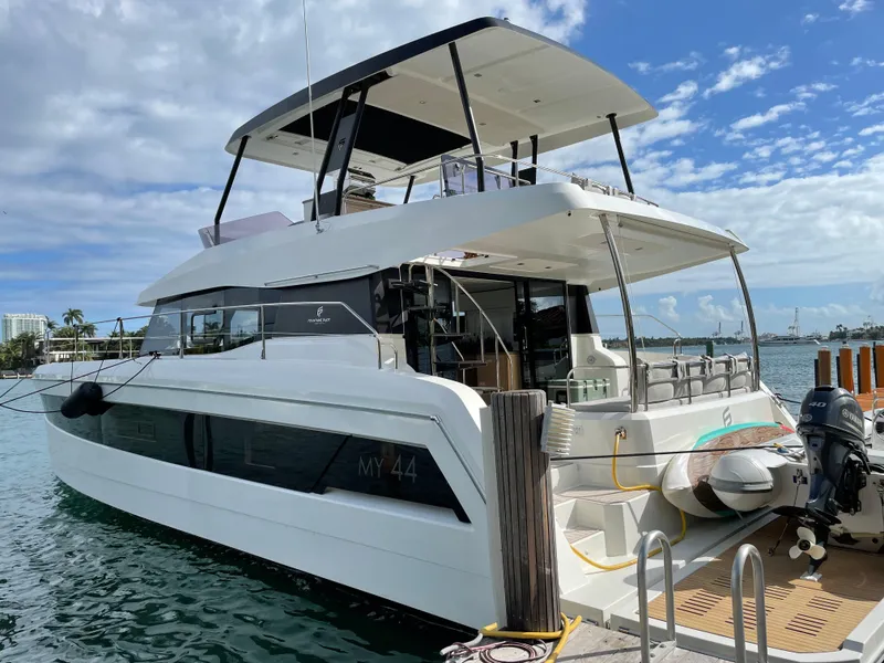 Slide: The Image of 2020 Fountaine Pajot MY 44 yacht docked, featuring sleek design and spacious deck. - 2
