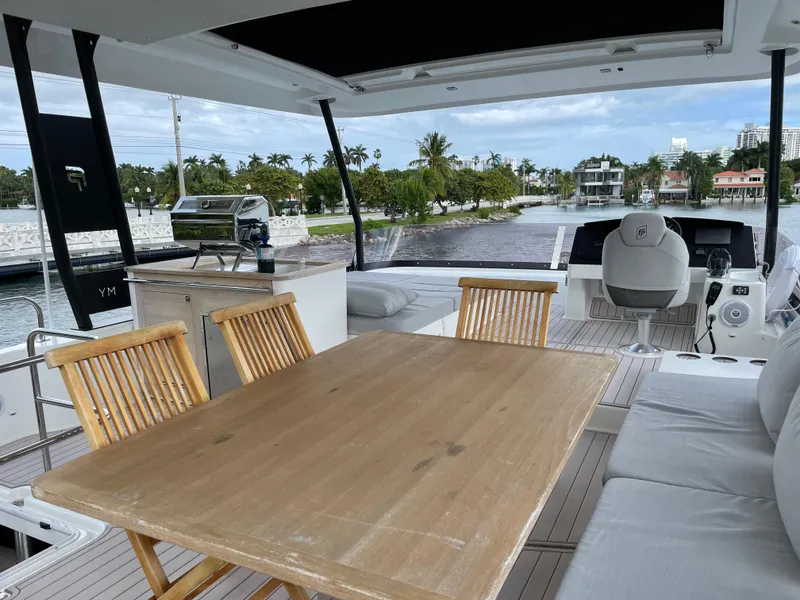 Slide: The Image of Luxurious 2020 Fountaine Pajot MY 44 yacht interior with dining area and helm station. - 25