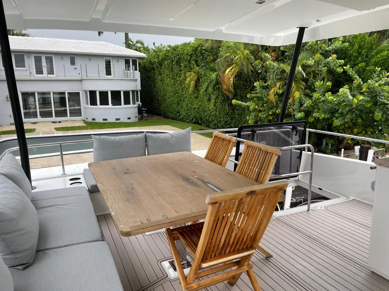 Slide: The Image of Outdoor seating area on a 2020 Fountaine Pajot MY 44 yacht, near a modern house. - 27