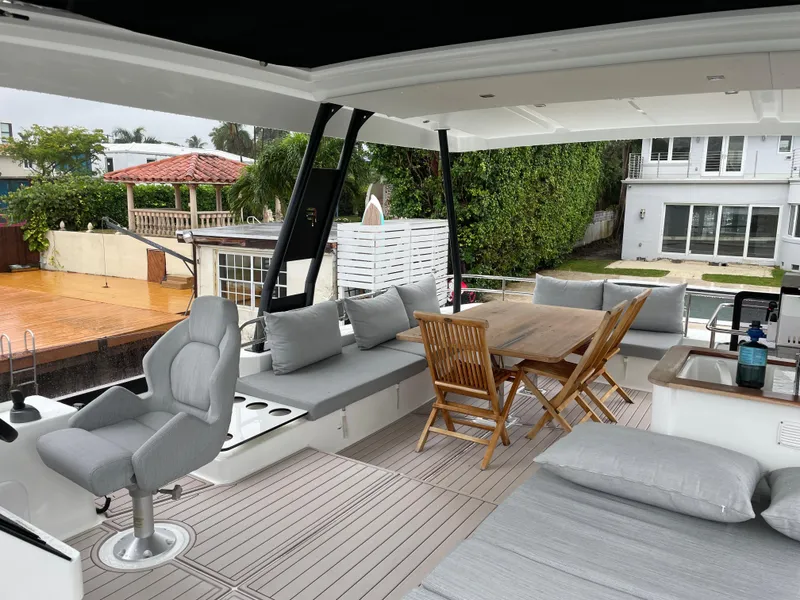 Slide: The Image of Spacious deck of 2020 Fountaine Pajot MY 44 yacht with seating and dining area. - 28
