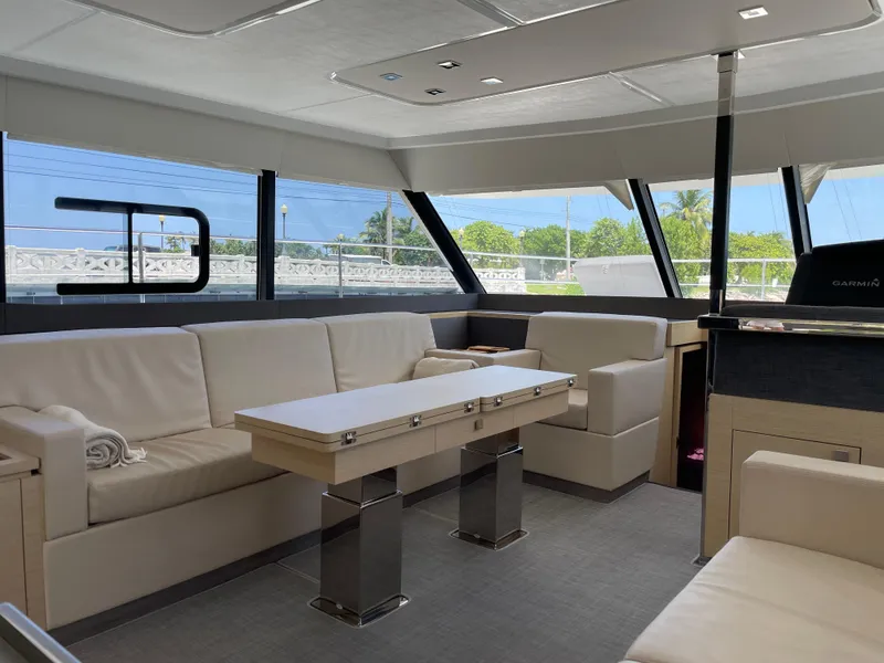 Slide: The Image of Luxurious interior of 2020 Fountaine Pajot MY 44 yacht with modern seating and table. - 29