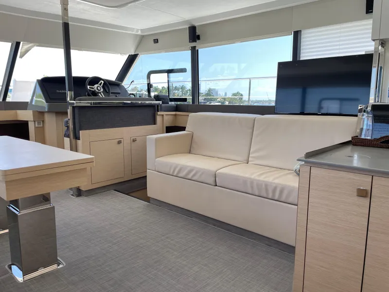 Slide: The Image of Interior of 2020 Fountaine Pajot MY 44 yacht with modern furnishings and helm station. - 31