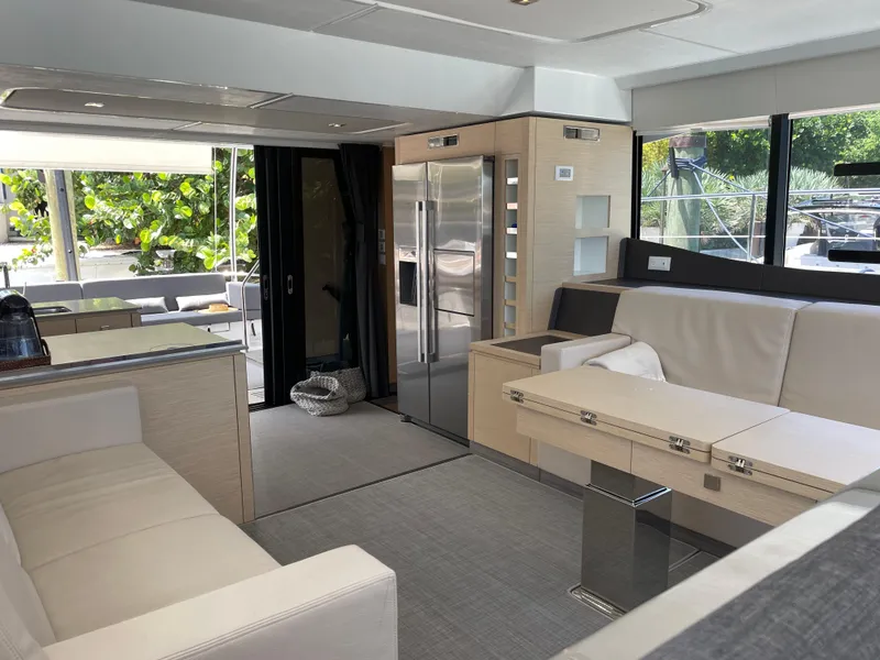 Slide: The Image of Luxurious interior of 2020 Fountaine Pajot MY 44 yacht with modern furnishings and large windows. - 32