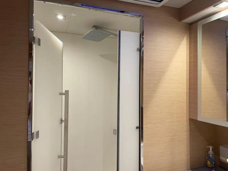 Slide: The Image of Modern shower in 2020 Fountaine Pajot MY 44 yacht bathroom, featuring sleek design and lighting. - 42