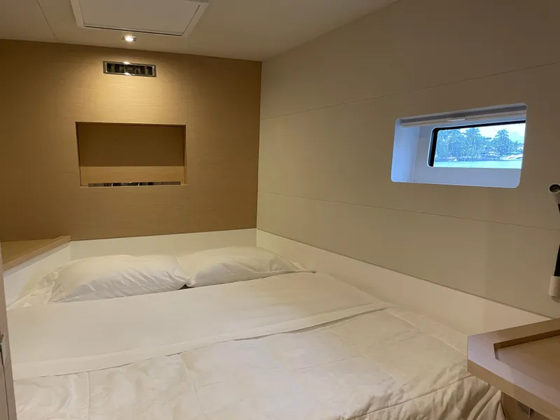 Slide: The Image of Cozy bedroom interior of 2020 Fountaine Pajot MY 44 yacht with window view. - 45