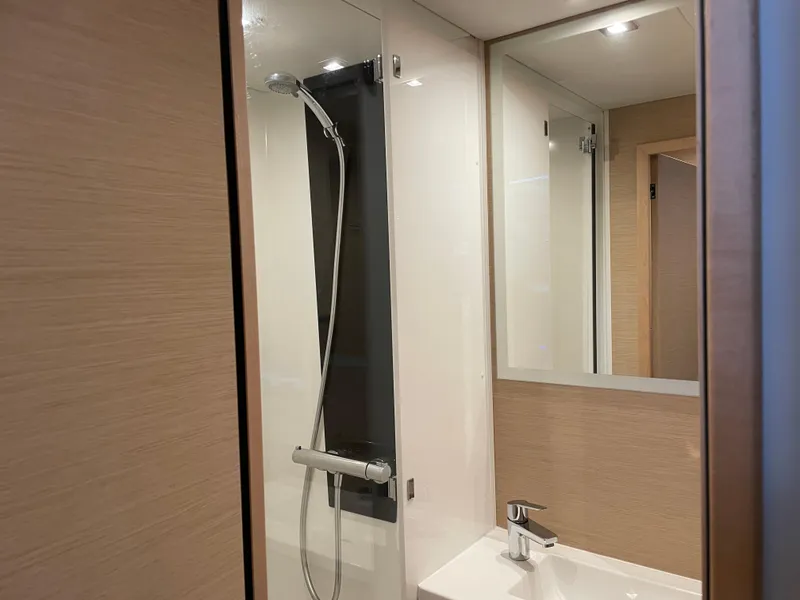 Slide: The Image of Modern bathroom interior on 2020 Fountaine Pajot MY 44 yacht, featuring sleek shower and sink. - 47