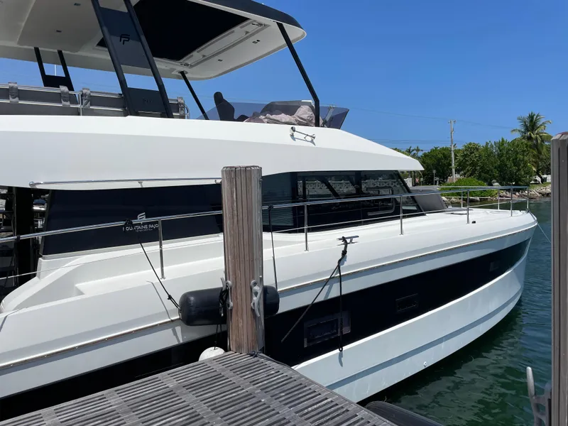 Slide: The Image of 2020 Fountaine Pajot MY 44 yacht docked, showcasing sleek design and modern features. - 5