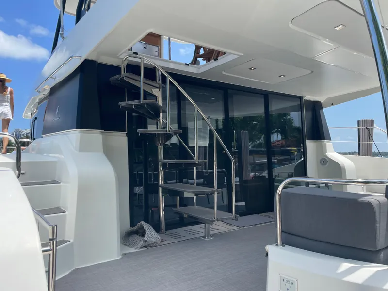 Slide: The Image of Fountaine Pajot MY 44 yacht, 2020 model, featuring sleek design and spiral staircase. - 8