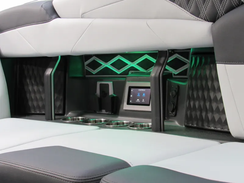 Slide: The Image of 2025 Malibu M230 interior with modern design, featuring cup holders and digital controls. - 13