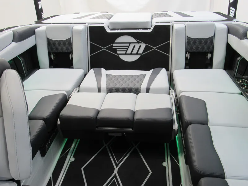 Slide: The Image of 2025 Malibu M230 boat interior with luxurious seating and modern design. - 17
