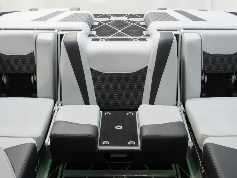 Slide: The Image of 2025 Malibu M230 boat interior with modern, luxurious seating design. - 18