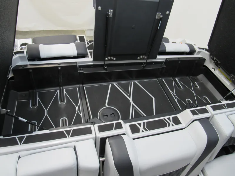 Slide: The Image of Interior of 2025 Malibu M230 boat with modern seating and storage design. - 19