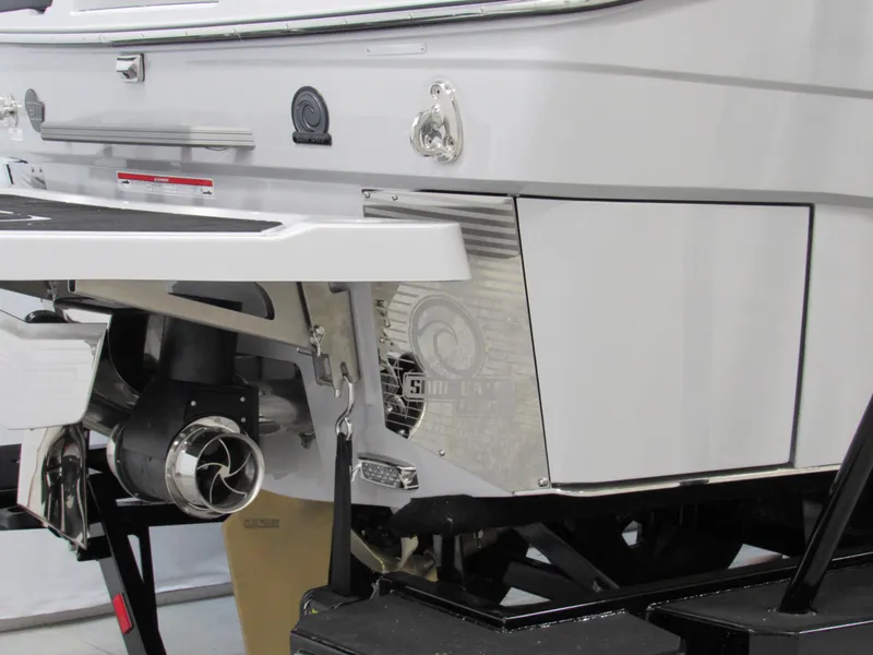 Slide: The Image of 2025 Malibu M230 boat rear view, showcasing sleek design and advanced propulsion system. - 3