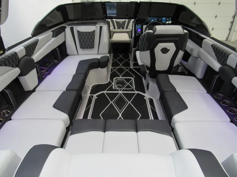 Slide: The Image of Luxurious interior of 2025 Malibu M230 boat with modern seating and sleek design. - 5