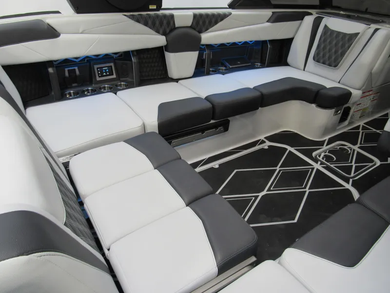 Slide: The Image of Luxurious interior of 2025 Malibu M230 boat with modern seating and stylish design. - 6