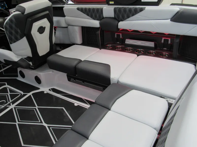 Slide: The Image of 2025 Malibu M230 boat interior with modern seating and stylish design. - 8