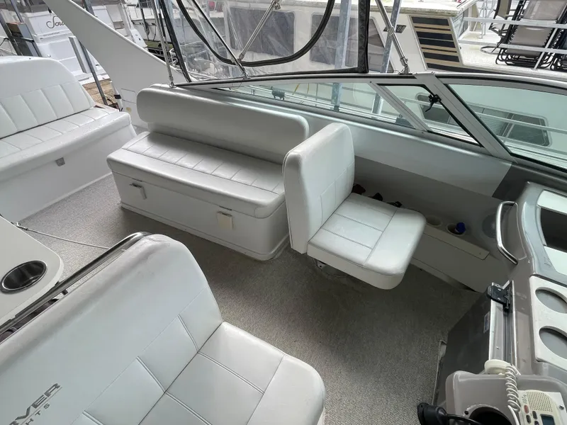 Slide: The Image of Interior of 2002 Carver 350 Mariner boat with white seating and modern design. - 13