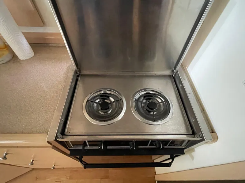 Slide: The Image of Two-burner stove in 2002 Carver 350 Mariner yacht kitchen. - 25