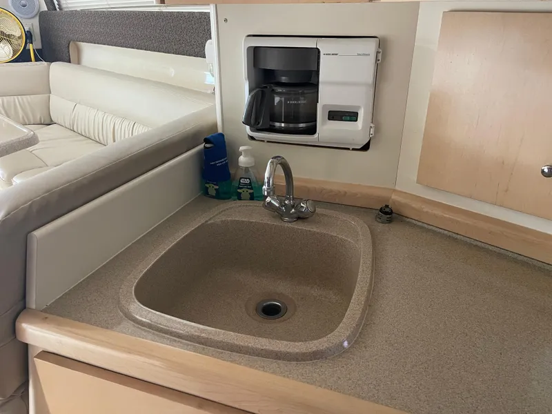 Slide: The Image of 2002 Carver 350 Mariner interior with sink and built-in coffee maker. - 27