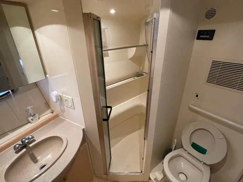 Slide: The Image of Bathroom interior of 2002 Carver 350 Mariner yacht with shower, sink, and toilet. - 32