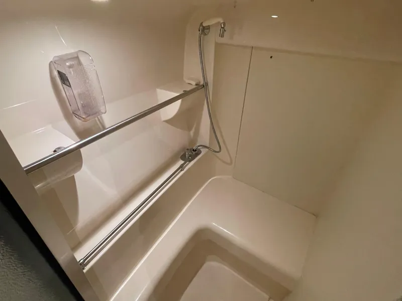 Slide: The Image of 2002 Carver 350 Mariner bathroom with shower and chrome fixtures. - 34