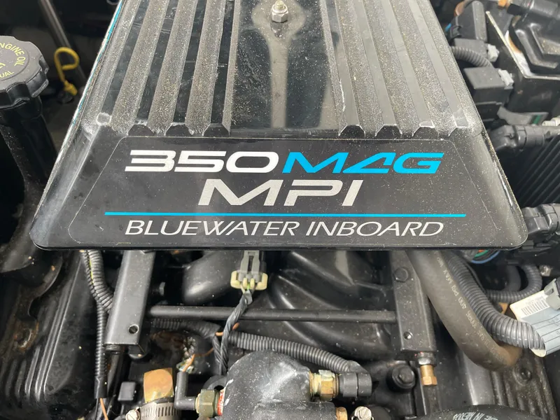 Slide: The Image of Close-up of a 2002 Carver 350 Mariner's 350 MAG MPI Bluewater inboard engine. - 35