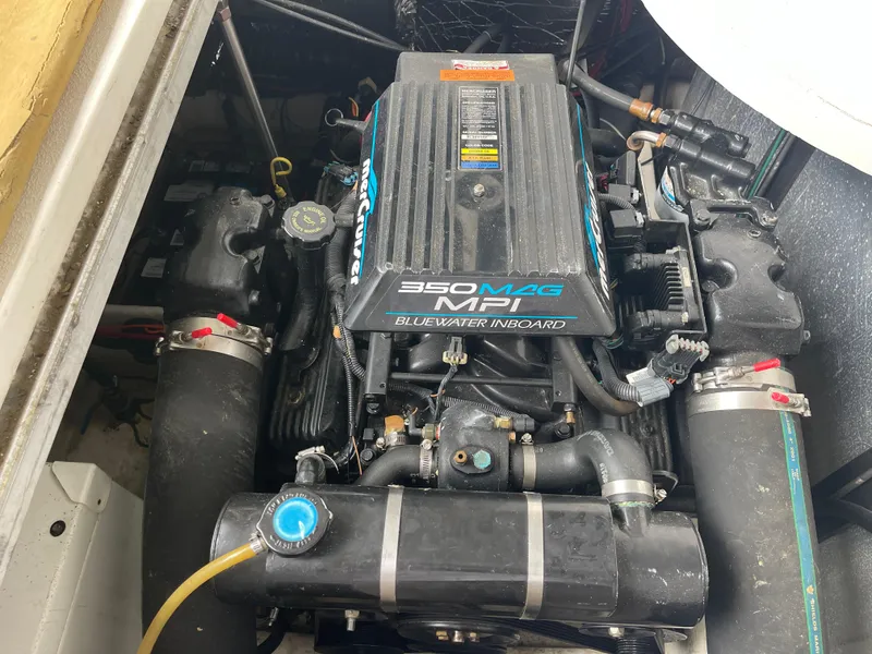 Slide: The Image of Engine compartment of a 2002 Carver 350 Mariner with 350 MAG MPI motor. - 36