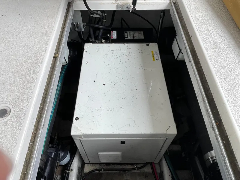 Slide: The Image of Engine compartment of a 2002 Carver 350 Mariner boat, showing machinery and wiring. - 38