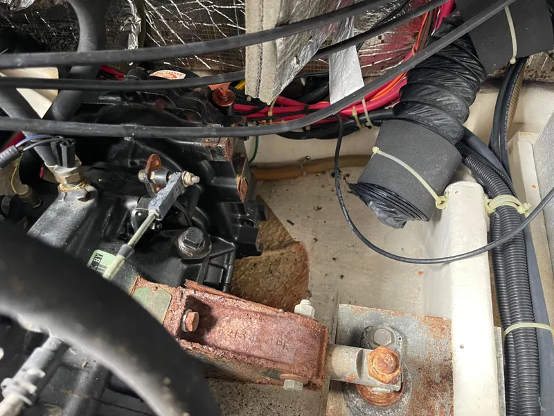 Slide: The Image of Engine compartment of a 2002 Carver 350 Mariner with visible wiring and components. - 40