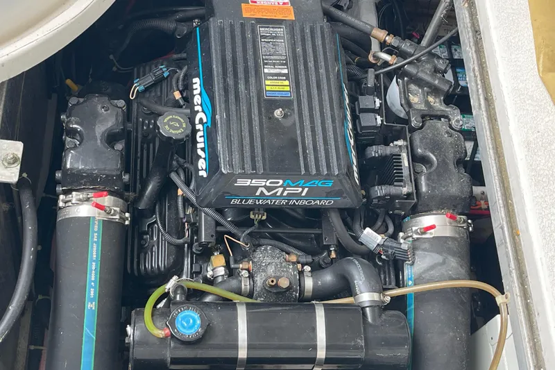 Slide: The Image of Engine of a 2002 Carver 350 Mariner boat, featuring a MerCruiser 350 MAG MPI. - 41